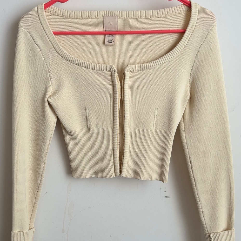 Pale yellow ribbed cardigan metal clasp sweater